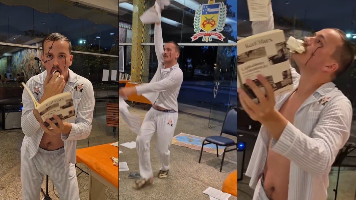 Artista “devora” obra de Marx na Feira do Livro da UFSC e post da performance tem comentários desativados